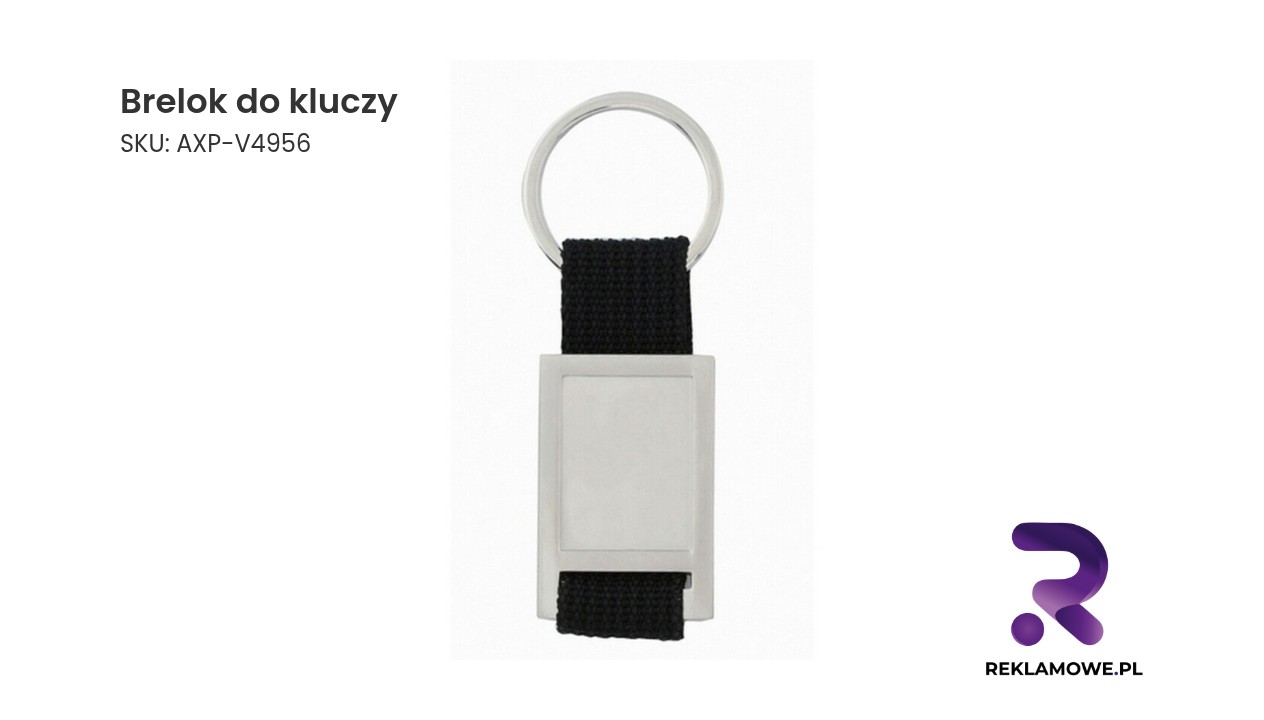 Brelok do kluczy Brelok do kluczy w kształcie serca na tle drewnianego stołu